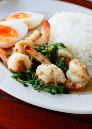Stir-fried Thai basil with shrimp and boiled eggの写真素材