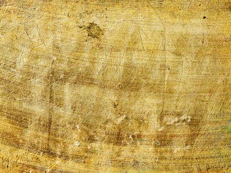 Grunge scratched golden textureの写真素材