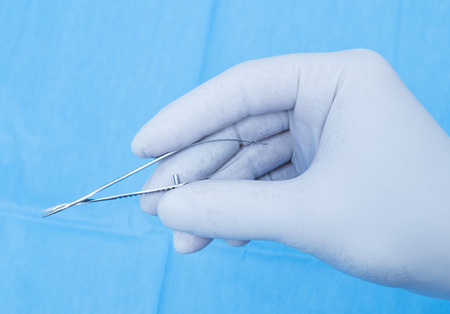 Hand with scissors