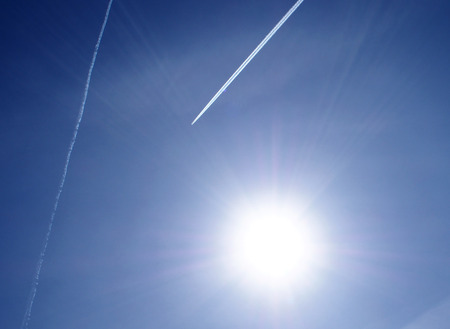 Sun, plane and sky