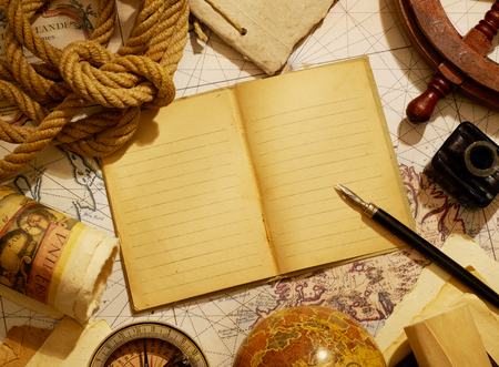 Notebook and marine equipment over old map from XVIII century