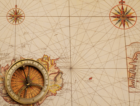 Old compass over ancient map from XVIII century