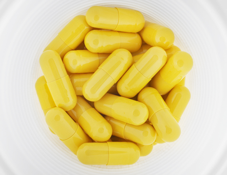 Pills in a plastic glass