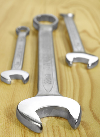 Wrenches on woodの写真素材