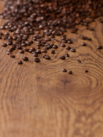 Coffee beans on woodの写真素材
