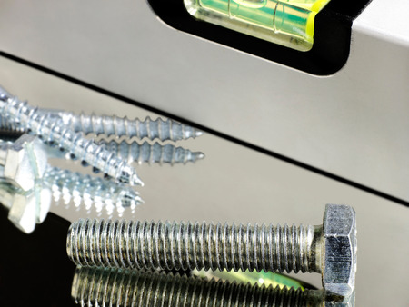 Level and screws close-up