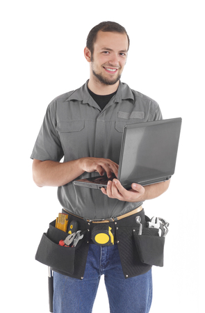 Carpenter working with laptopの写真素材