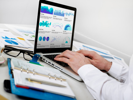 Business man working on graphs and charts