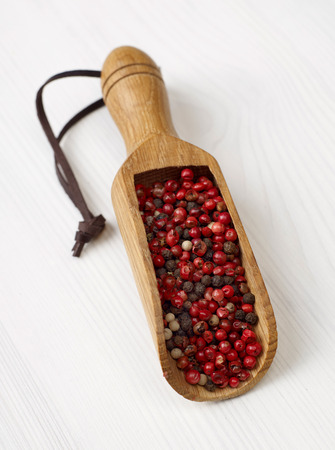 Pepper scoop on woodの写真素材