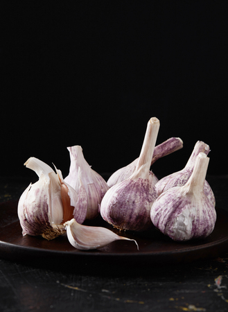 Purple garlic on blackの写真素材