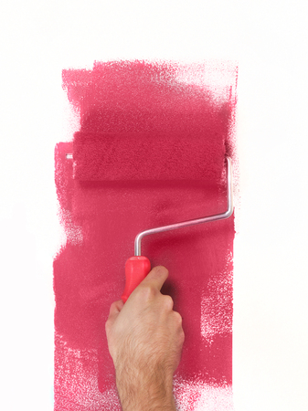 Hand with paint roller