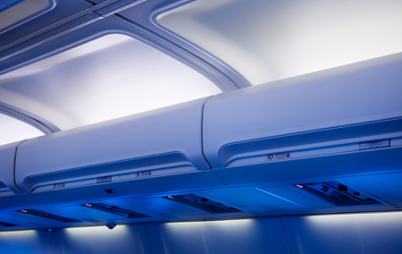 Storage compartments in a planeの写真素材