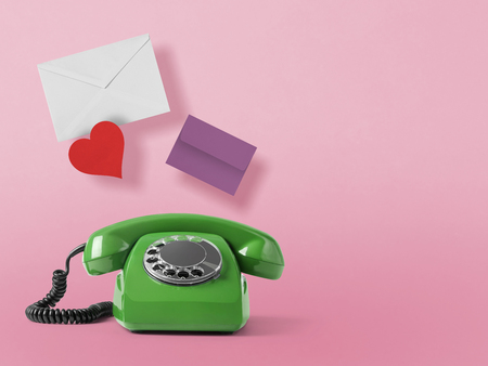 Vintage telephone on pink backgroundの写真素材