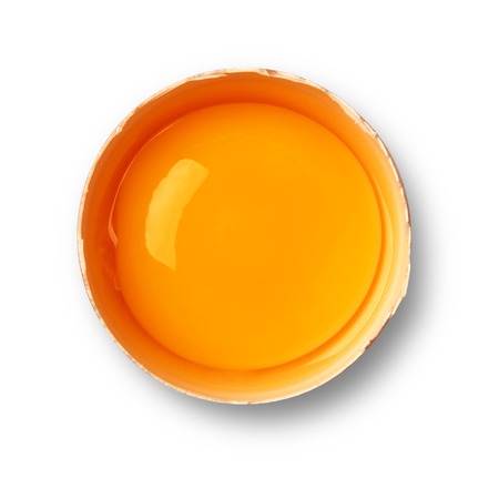 Brown eggs yolk isolated on whiteの写真素材