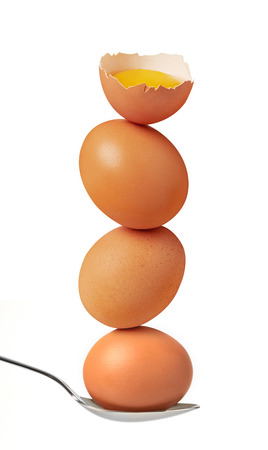 Impossible balanced eggs isolated on white