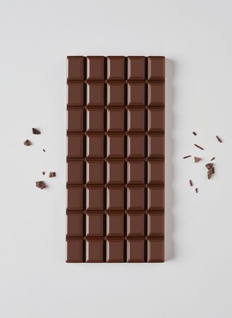 Brown chocolate bar isolated on grayの写真素材