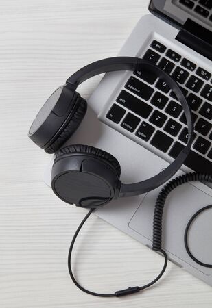 Headphones on laptop close-up detailの写真素材