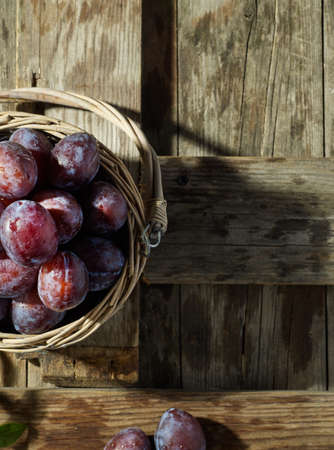 Fresh farm plums with leafsの写真素材