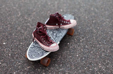 Used canvas shoes on skateboard