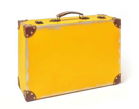 Yellow vintage suitcase on white backgroundの写真素材