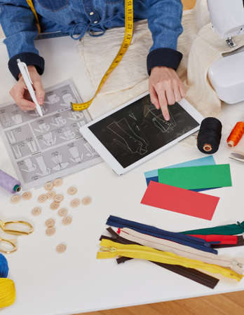 Tailor woman reviewing the blueprintsの写真素材