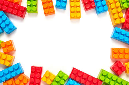 Multi-colored toy bricks frame on white backgroundの写真素材