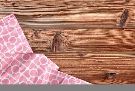 Pink kitchen towel on wood