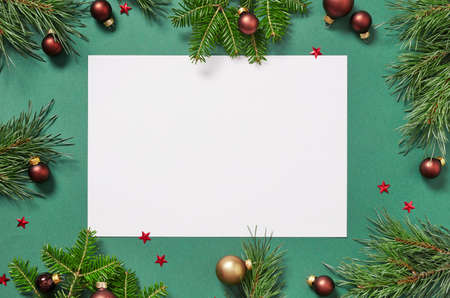 Fir tree branches and blank paper