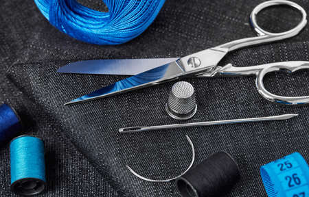 Tailoring concept closeup detail on dark blue