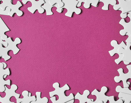 Puzzle frame on pink backgroundの写真素材