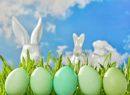 Green Easter eggs in grass