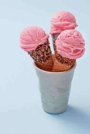 Artisanal ice cream cones on blue