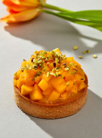 Mango tart on gray backgroundの写真素材