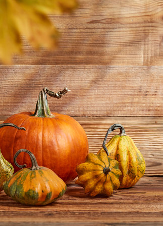 Pumpkins cloesup detail on wooden backgroundの写真素材