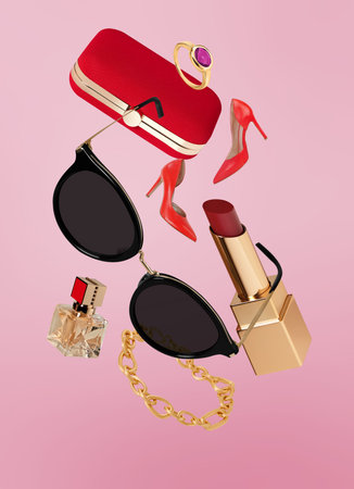 Flying women accesories on pink backgroundの写真素材