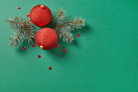 Christmas balls and fir tree,Directly Above Shot Of Christmas Decorations On Green Backgroundの写真素材