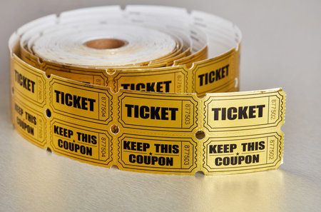 Golden raffle ticket roll with extended ticket strip