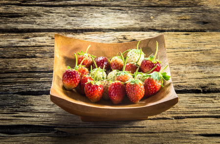 strawberry on a dark wood backgroundの写真素材