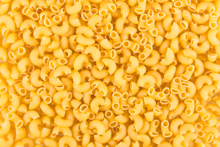 raw pasta on wood backgroundの写真素材