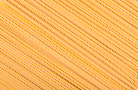 raw pasta on wood backgroundの写真素材