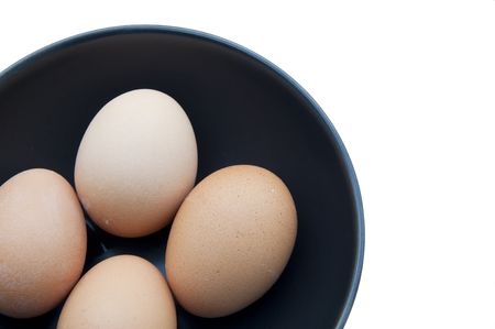 egg on black cup as white isolate backgroundの写真素材