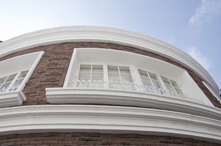 Curve building as blue skyの写真素材