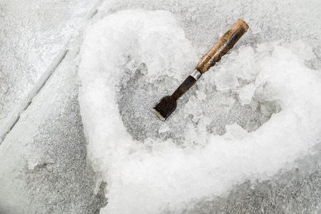 ice in heart shaped and chiselの写真素材