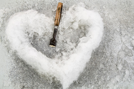 ice in heart shaped and chisel 2の写真素材