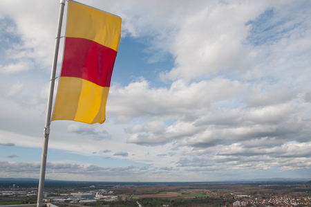 Flag of Baden-WÃ?'?,¼rttemberg over the city of Karlsruheの写真素材