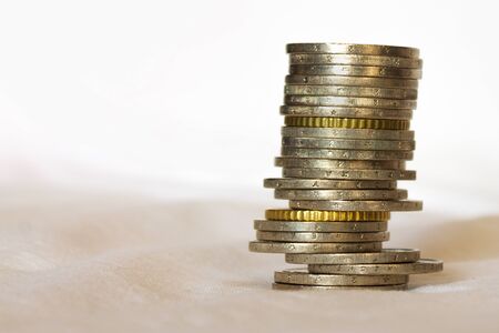 Pile of euro coins on white background with copy spaceの写真素材