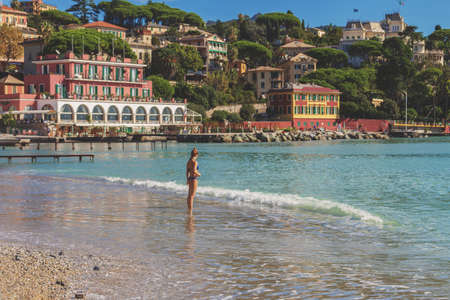 A woman in bikini on the sea beach in Santa Margherita Ligure, Italyの写真素材