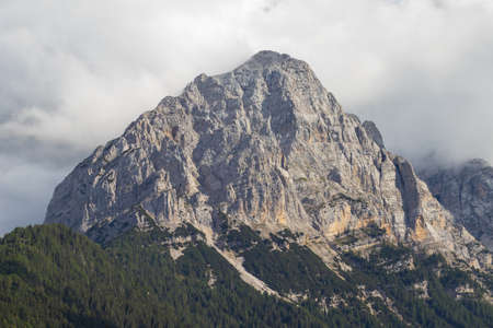 Cima Brenta, the highest mountain in Brenta Dolomites, from Rendena Valley on a cloudy day. Trentino...