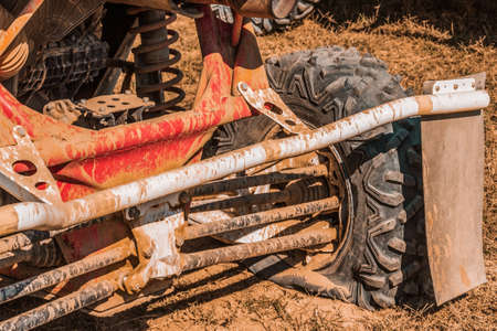 High angle view of an utv vehicle with a puncture on the right rear tire. Concept of motorsport,...