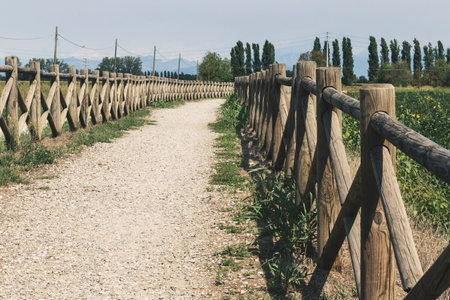 High angle view of a fenced walkway in the country. Copy spaceの写真素材